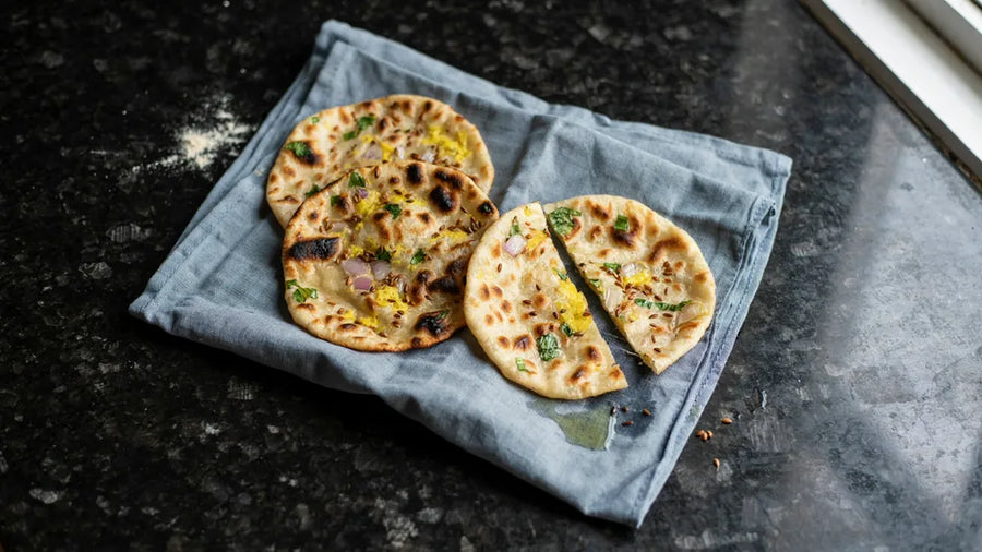 Punjabi missi rotis with besan, onion and ajwain, deep golden with charred spots, using CressPure Sharbati atta