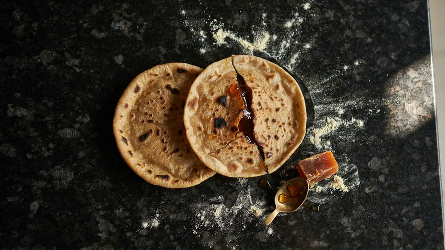 Gur wali roti torn to show molten jaggery inside, made with CressPure Premium Sharbati Atta