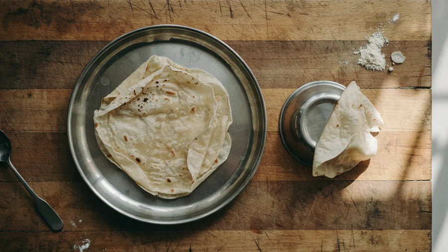 Paper-thin rumali roti folded on a steel thali, made at home with CressPure Premium Sharbati Atta