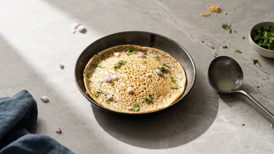 Atta chilla lifting cleanly from the pan in one unbroken piece, made with CressPure Sharbati atta