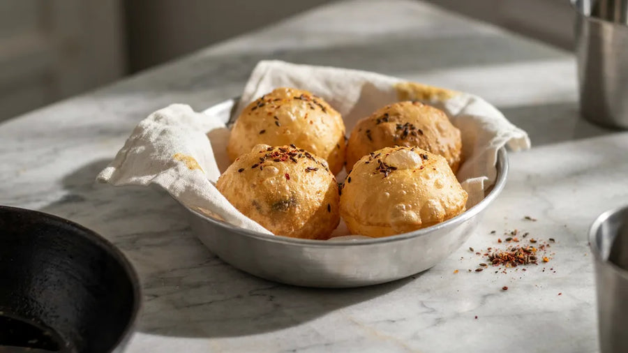 Masala pooris puffed into golden domes flecked with ajwain, made with CressPure Premium Sharbati Atta