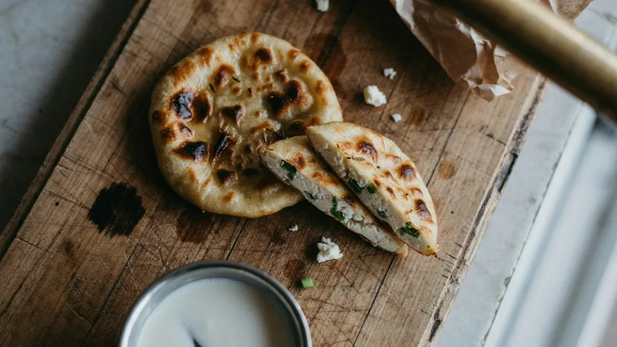 Paneer paratha cut to show an even layer of crumbled paneer, made with CressPure Premium Sharbati Atta