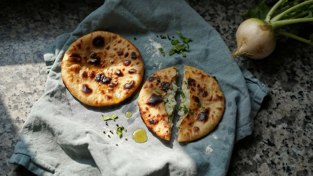 Mooli paratha torn open to show a dry grated radish filling with no water leak, made with CressPure atta