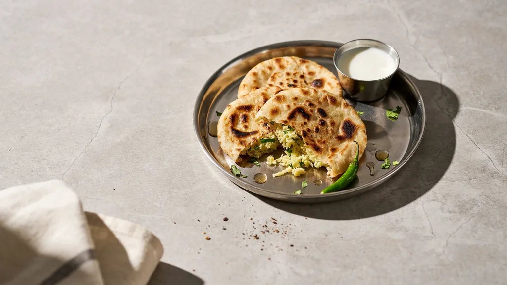 Gobi paratha torn open to show a dry, well-squeezed cauliflower filling, made with CressPure Sharbati atta